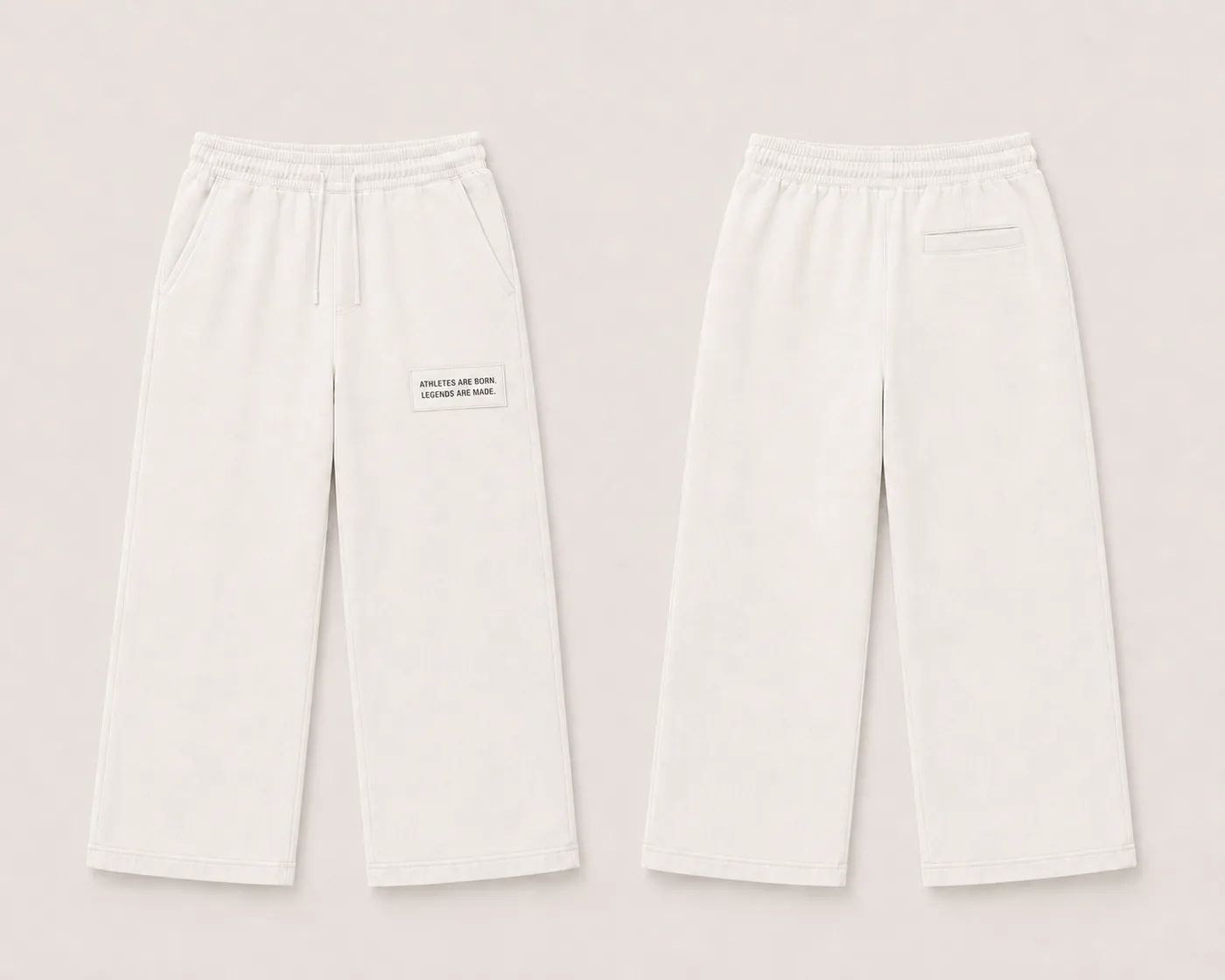 MADE Sweatpant in bone, wide straight leg, with a white legacy patch on the wearer's left upper thigh