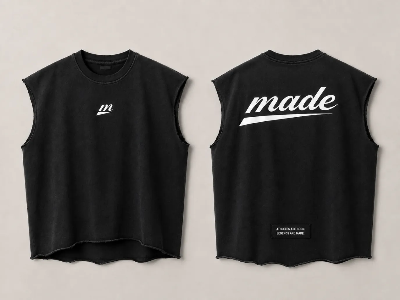 MADE Raw-Edge Cutoff in black with raw armholes, the m icon at chest, the made wordmark at back and a woven patch above the raw hem