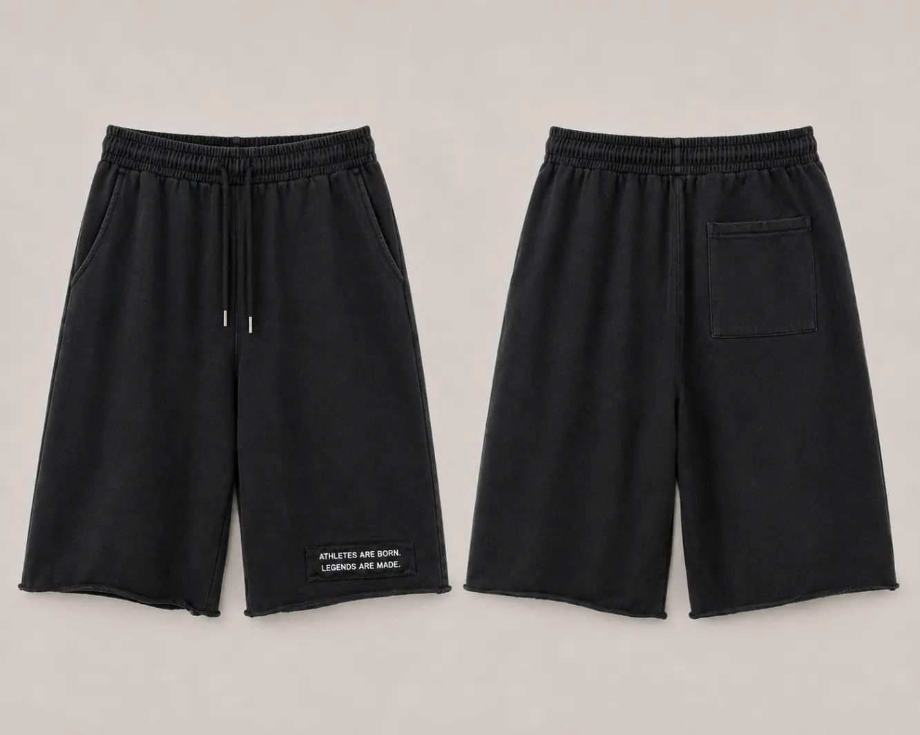 MADE Long Short in black, knee length with a raw hem and a legacy patch on the wearer's left leg